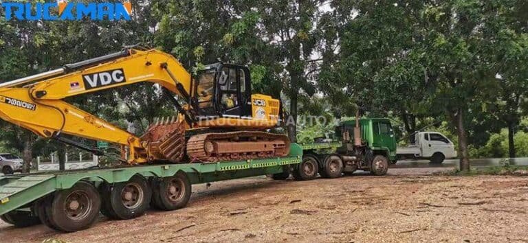 Transporte de máquinas florestais em camiões de caixa baixa