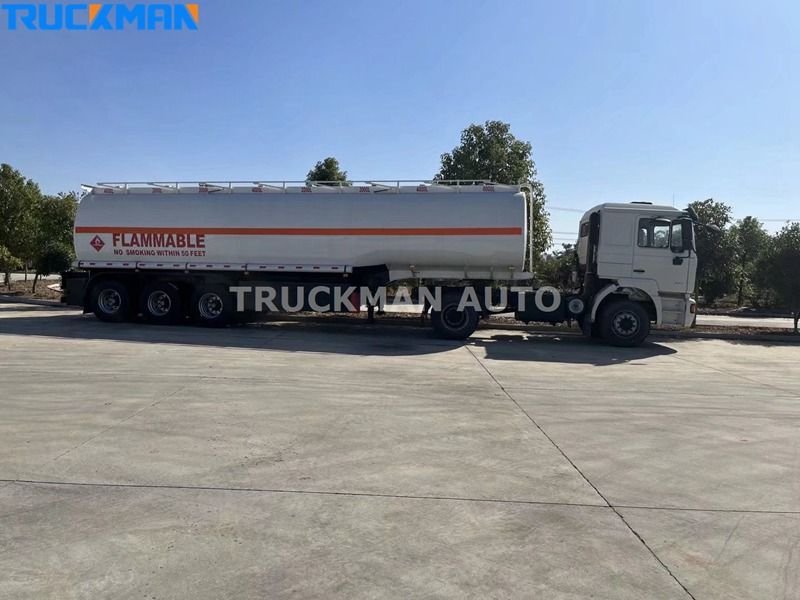 Reboque de camião cisterna branco estacionado em betão com sinais de aviso "Inflamável", por Truckman Auto
